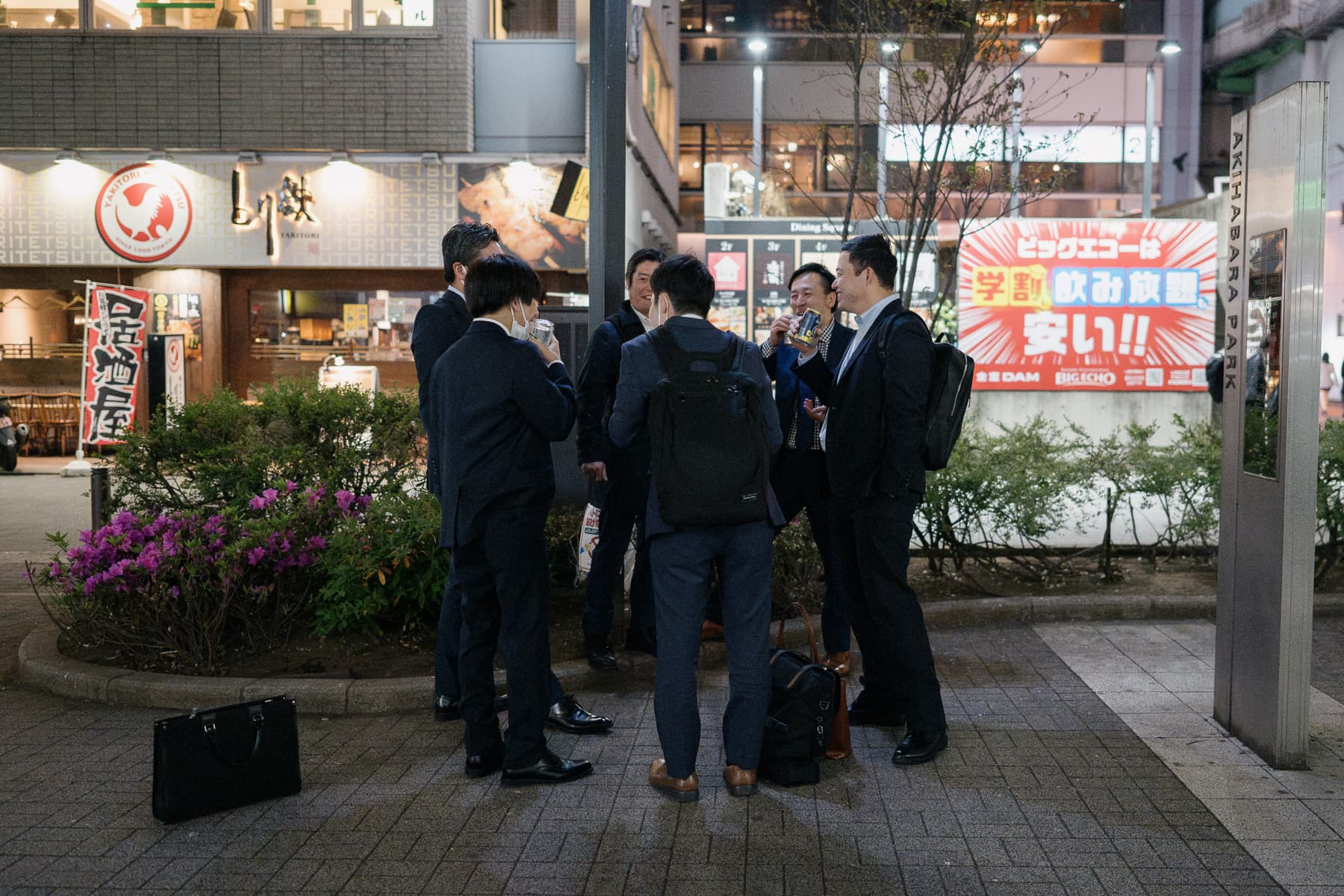 <span style="color: rgb(0, 0, 0);">A group of men having a quick drink after work. Working people often face pressure to attend social gatherings with their co-workers.</span>